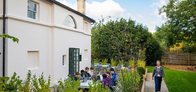 Secondary School outside space with students and teacher