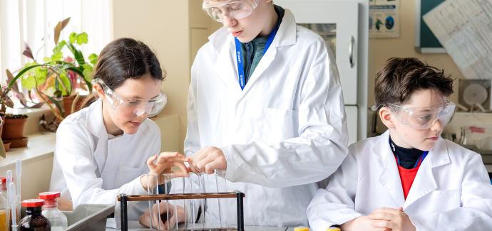 Liberty Secondary Science students with science equipment in lab