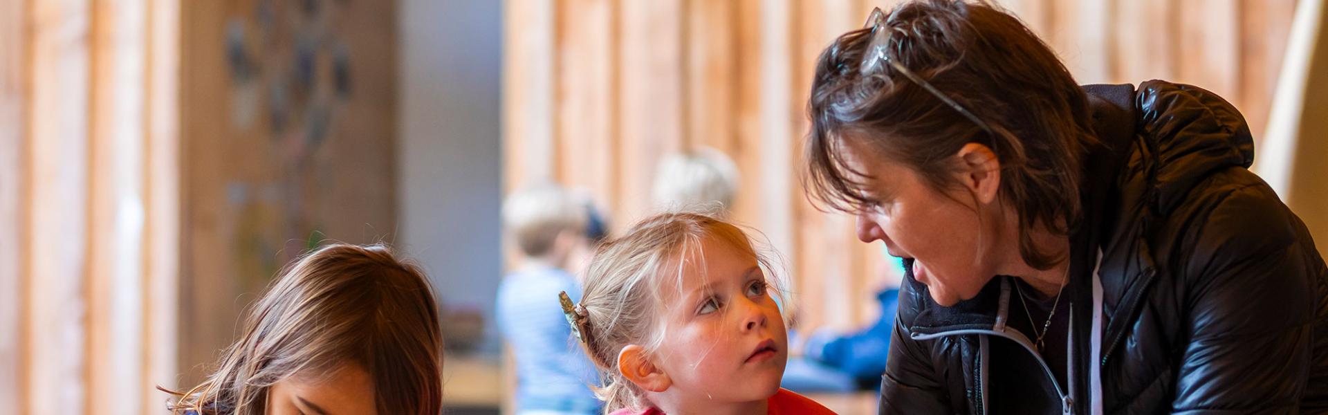 Nursery learners with teacher in outdoor classroom